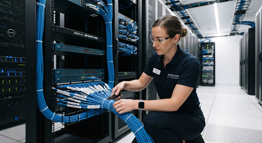 Technician maintaining enterprise network systems